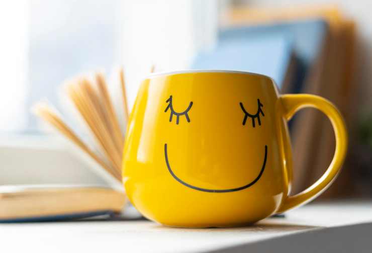 open book smiley yellow cup 1