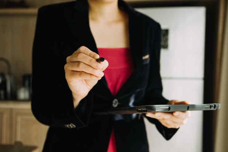 Mature Businessman Using Digital Tablet Discuss Information With Younger Colleague Moder 1
