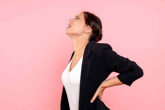 front view young female dark jacket pink background 1