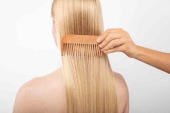 Close Up Hand Using Comb 1